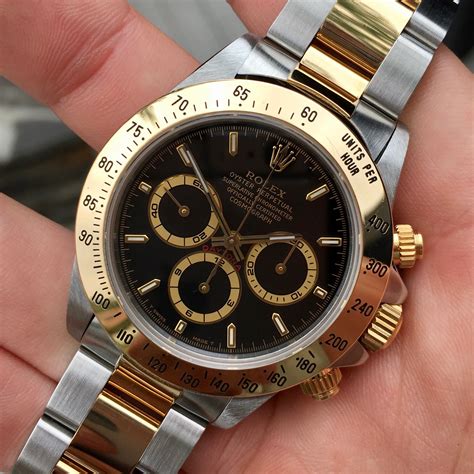 rolex daytona black gold